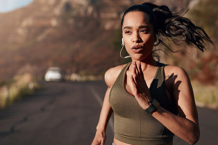 A female athlete using a women's health probiotic